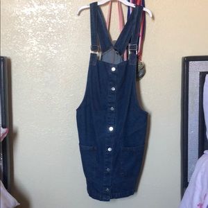 I am selling this buttoned denim dress New!